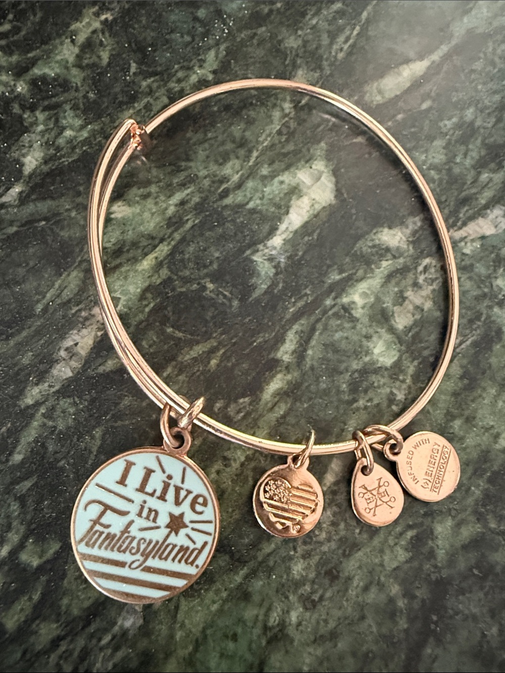 Alex and Ani Rose Gold Bangle with Light Blue 'I Live in Fantasyland' Charm